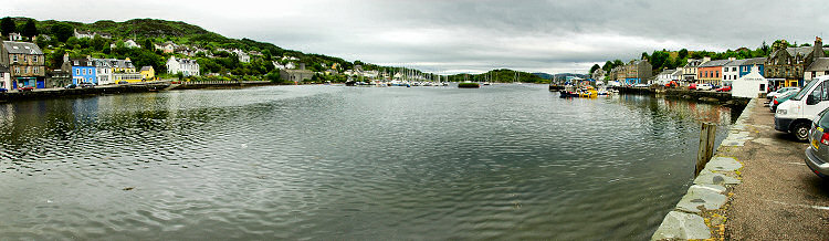 Picture of a panoramic view over a small harbour with sailing yachts and fishing boats