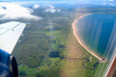 Picture of a wide bay on Islay seen from the plane