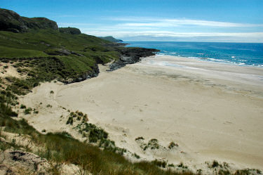 Picture of a view down some dunes on to a beach