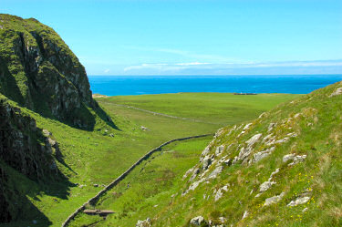 Picture of a small glen (valley) extending out into the open