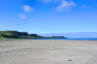 Picture of a beautiful bay with a sandy beach, hills in the distance