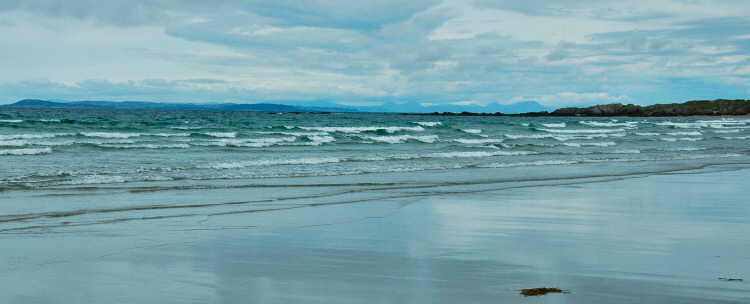 Picture of a panoramic view across the sea to two other islands