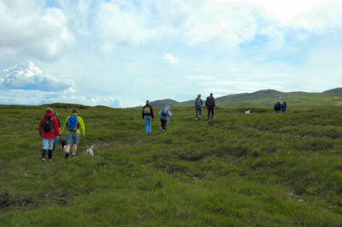 Picture of a group of walkers climbing up a hill