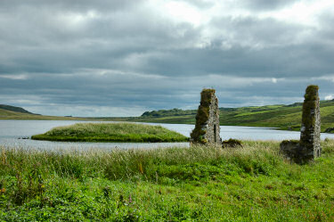 Picture of a view over an island with the ruin of a building over to another small island