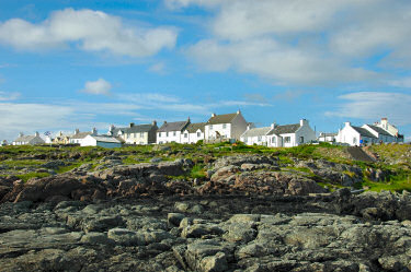 Picture of a row of houses above some rocks
