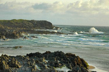 Picture of waves crashing over a rocky shore