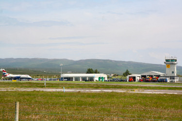 Picture of a small airport terminal with a plane (Islay Airport)