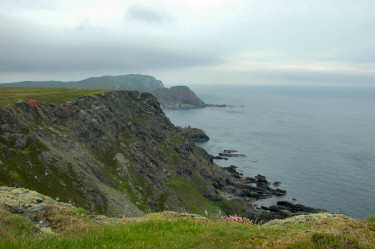 Picture of steep cliffs under a cloudy sky