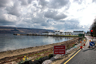 Picture of a view of coastal village from a temporary traffic light