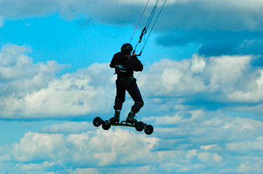 Picture of a kite surfer jumping