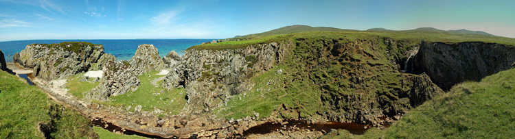 Picture of a panoramic view over a small river with a waterfall