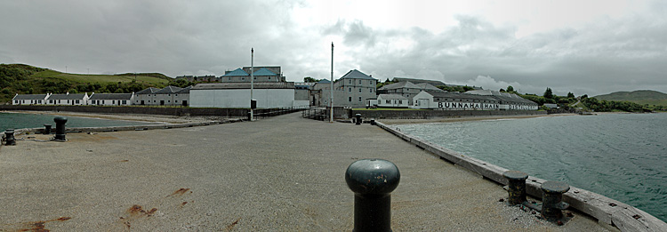 Picture of a panoramic view over a village dominated by a distillery (Bunnahabhain distillery on the Isle of Islay)