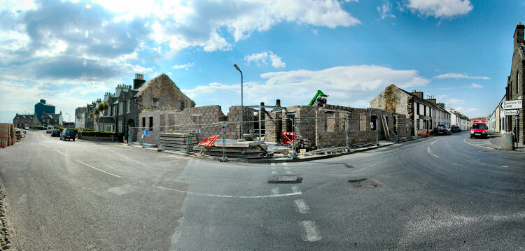 Panorama picture of a building site for a hotel, the ground floor is nearing completion