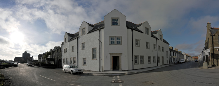 Panorama picture of a building site for a hotel, the entrance area has now been painted