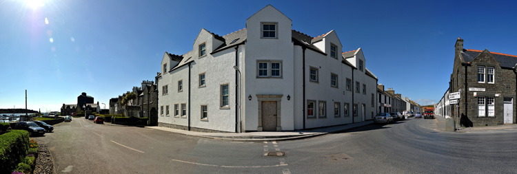 Panorama picture of a building site for a hotel, the entrance area has now been painted