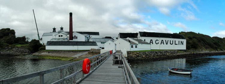 Picture of a distillery seen from the end of a pier
