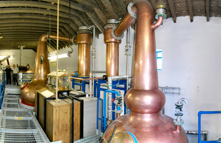 Picture of stills and spirit safe at a distillery