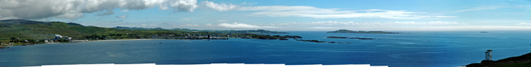 Picture of a panoramic view over a coastal port village and surrounding areas
