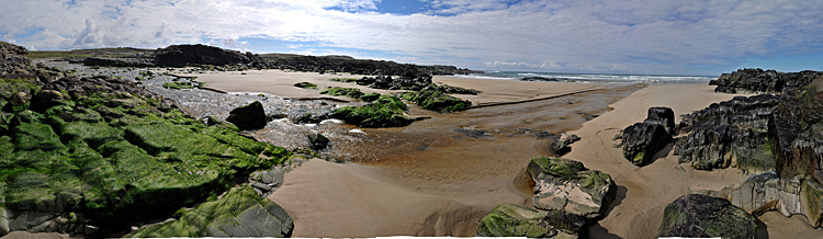 Picture of a panoramic view over a beach with a river running across