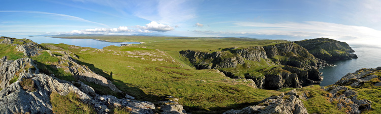 Picture of a panoramic view over a coastal landscape with steep cliffs