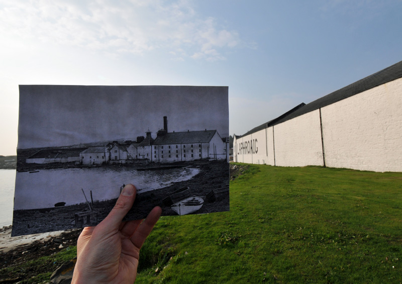 Composite picture of two pictures, old and new, showing Laphroaig distillery seen from the shore